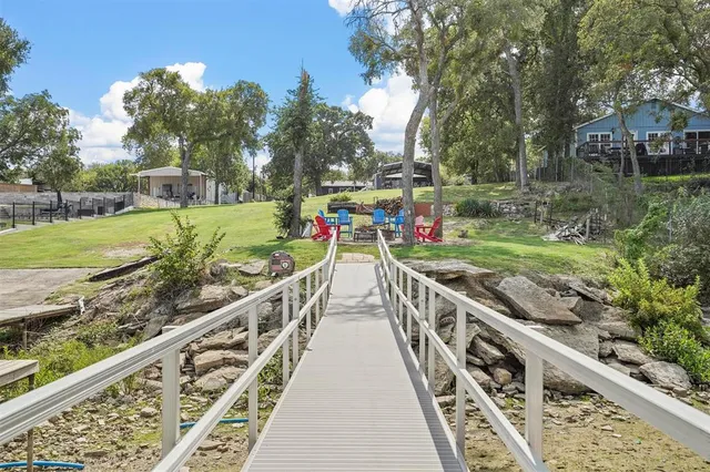 a view of a swimming pool with chairs