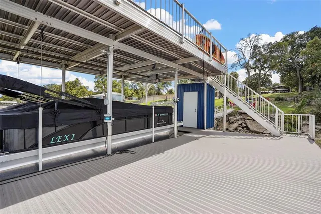 a house with swimming pool in front of it