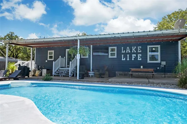 a view of balcony with wooden floor and outdoor seating