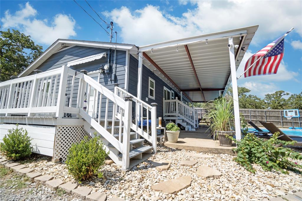 7130 Briar Road Azle, TX 76020 - Photo 4 of 37 a view of balcony with wooden floor and outdoor seating