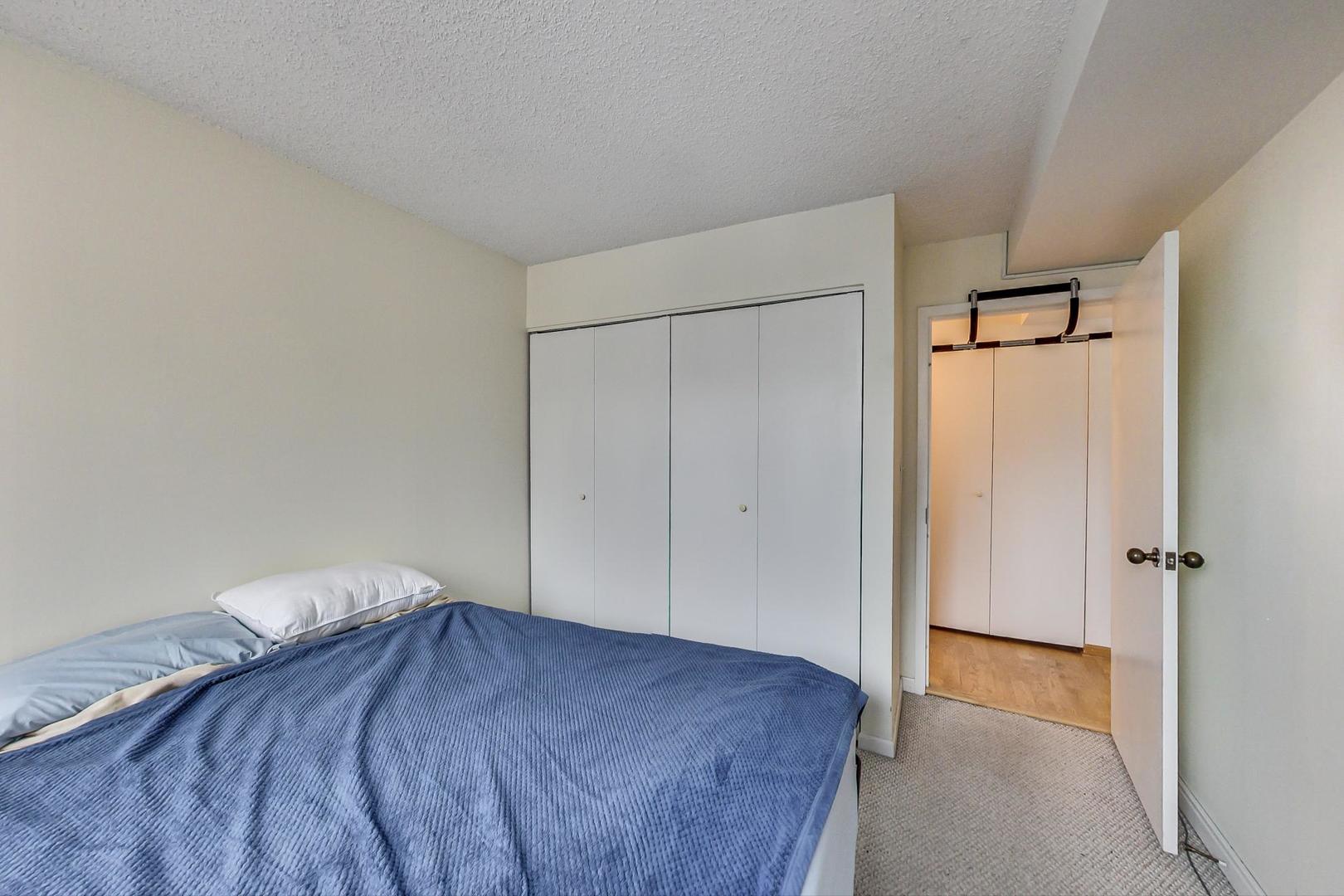 33 West Delaware Place, Unit 13A Chicago, IL 60610 - Photo 21 of 32 a bedroom with a bed and a shower