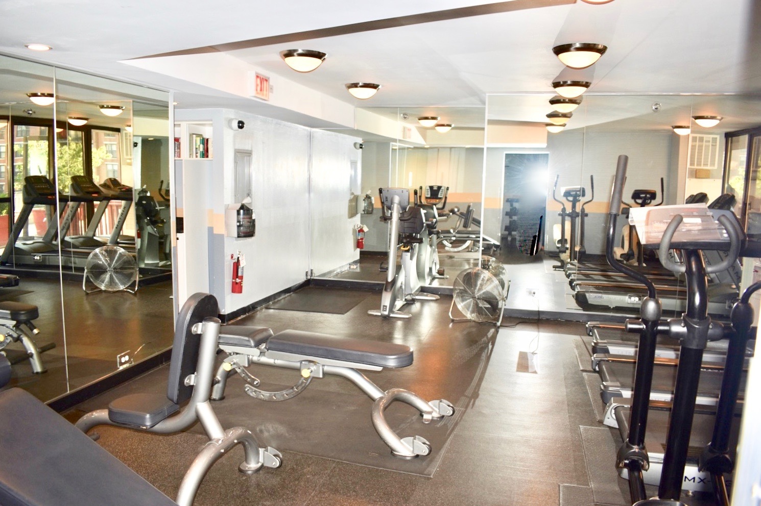 33 West Delaware Place, Unit 13A Chicago, IL 60610 - Photo 29 of 32 a gym room with lots of gym equipment