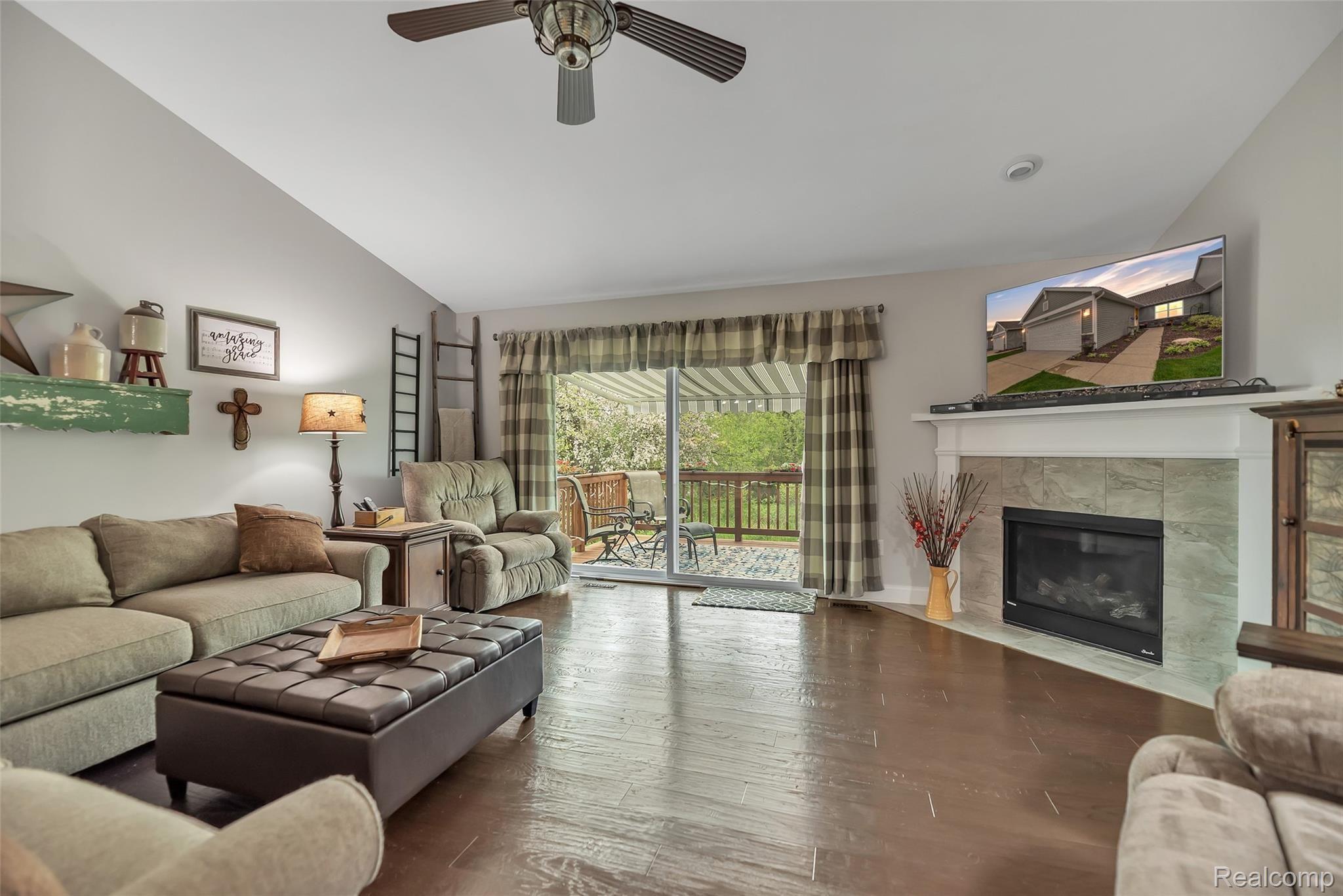 103 Sedum Road Howell, MI 48843 - Photo 12 of 30 Great Room With Soaring Ceilings And Cozy Gas Fireplace