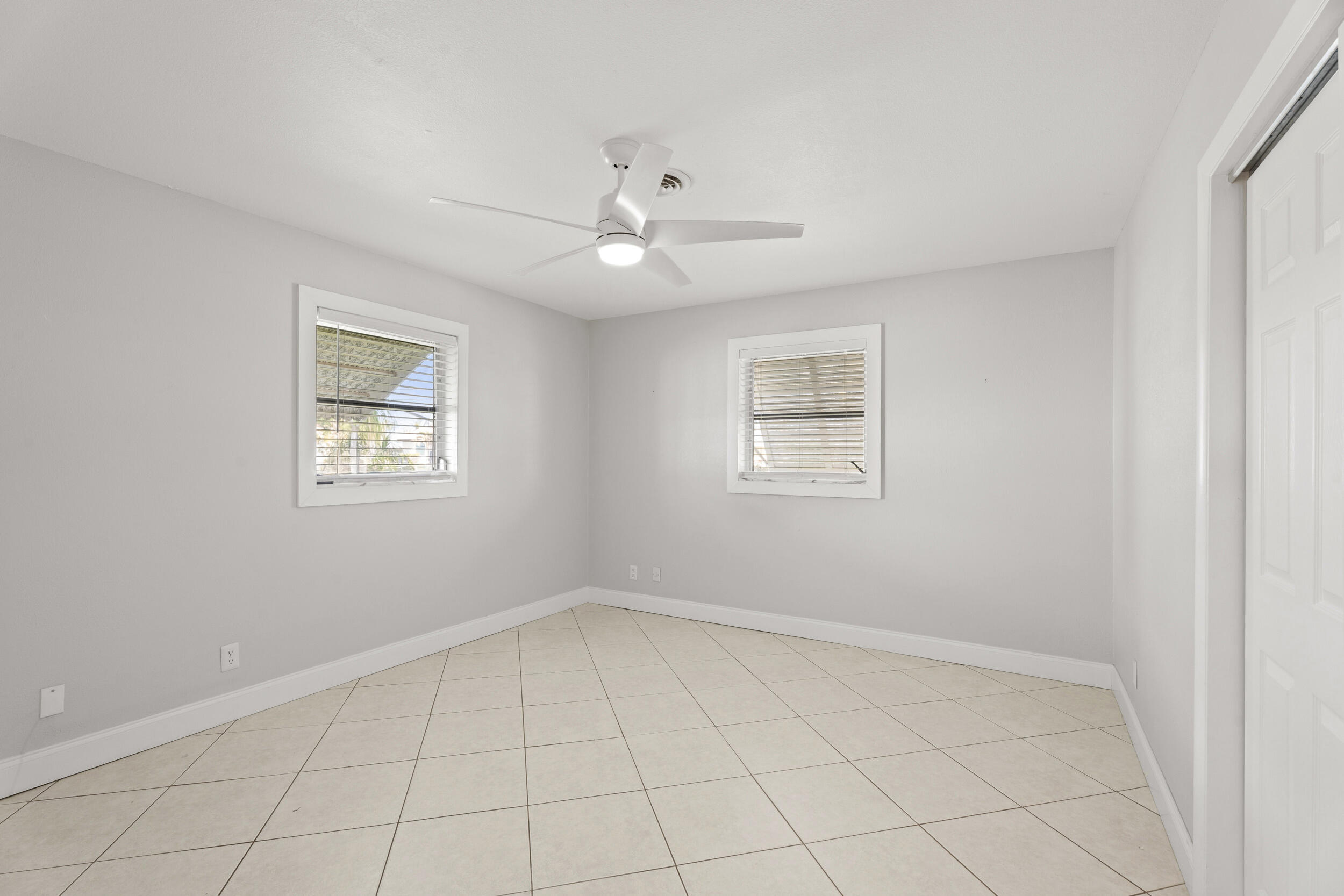 1459 Southwest Seahawk Way Palm City, FL 34990 - Photo 16 of 43 a view of an empty room with a window
