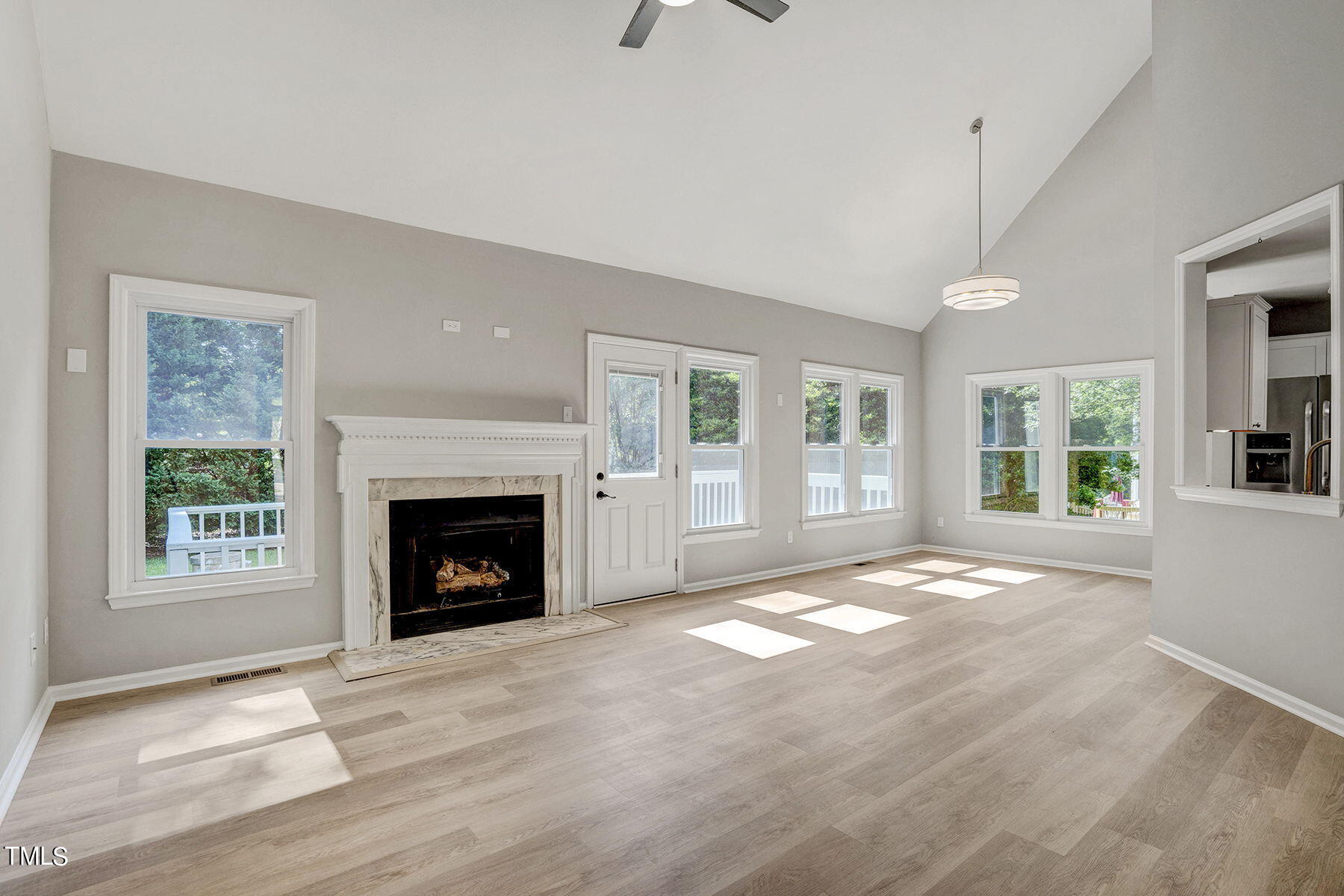 1248 Hillingdon Way Raleigh, NC 27614 - Photo 11 of 32 a view of an empty room with window and fire place