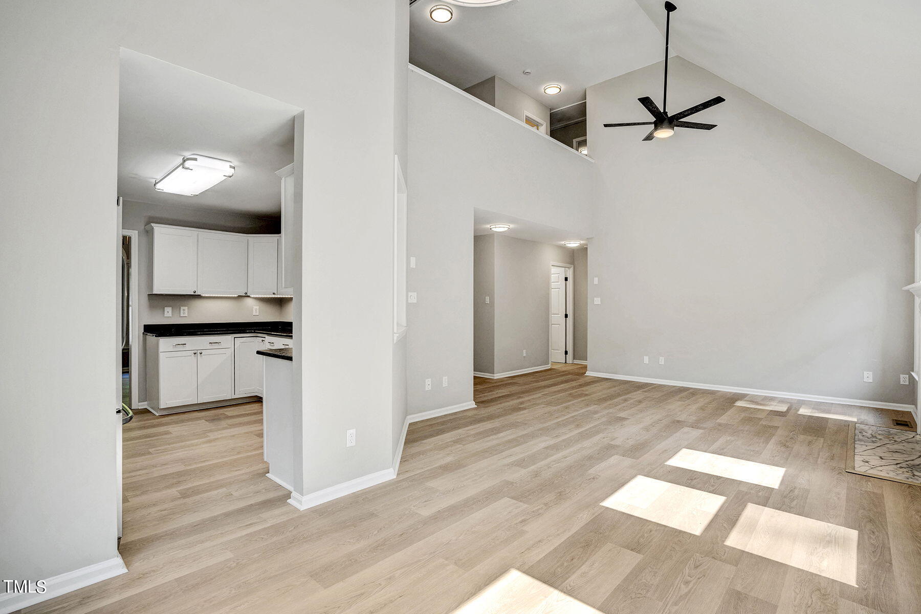 1248 Hillingdon Way Raleigh, NC 27614 - Photo 12 of 32 a view of a kitchen with wooden floor and a kitchen