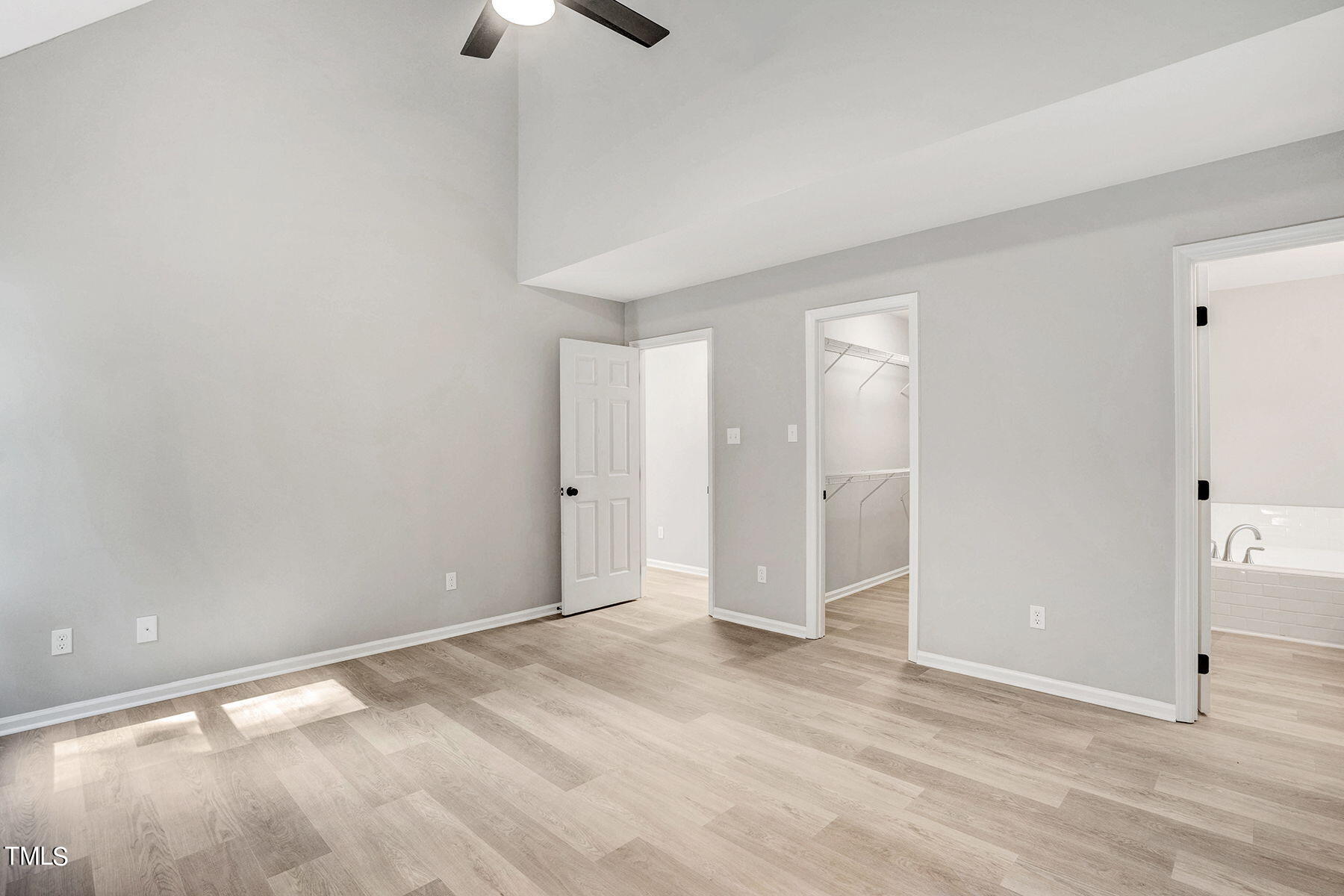 1248 Hillingdon Way Raleigh, NC 27614 - Photo 18 of 32 a view of an empty room with window and a ceiling fan