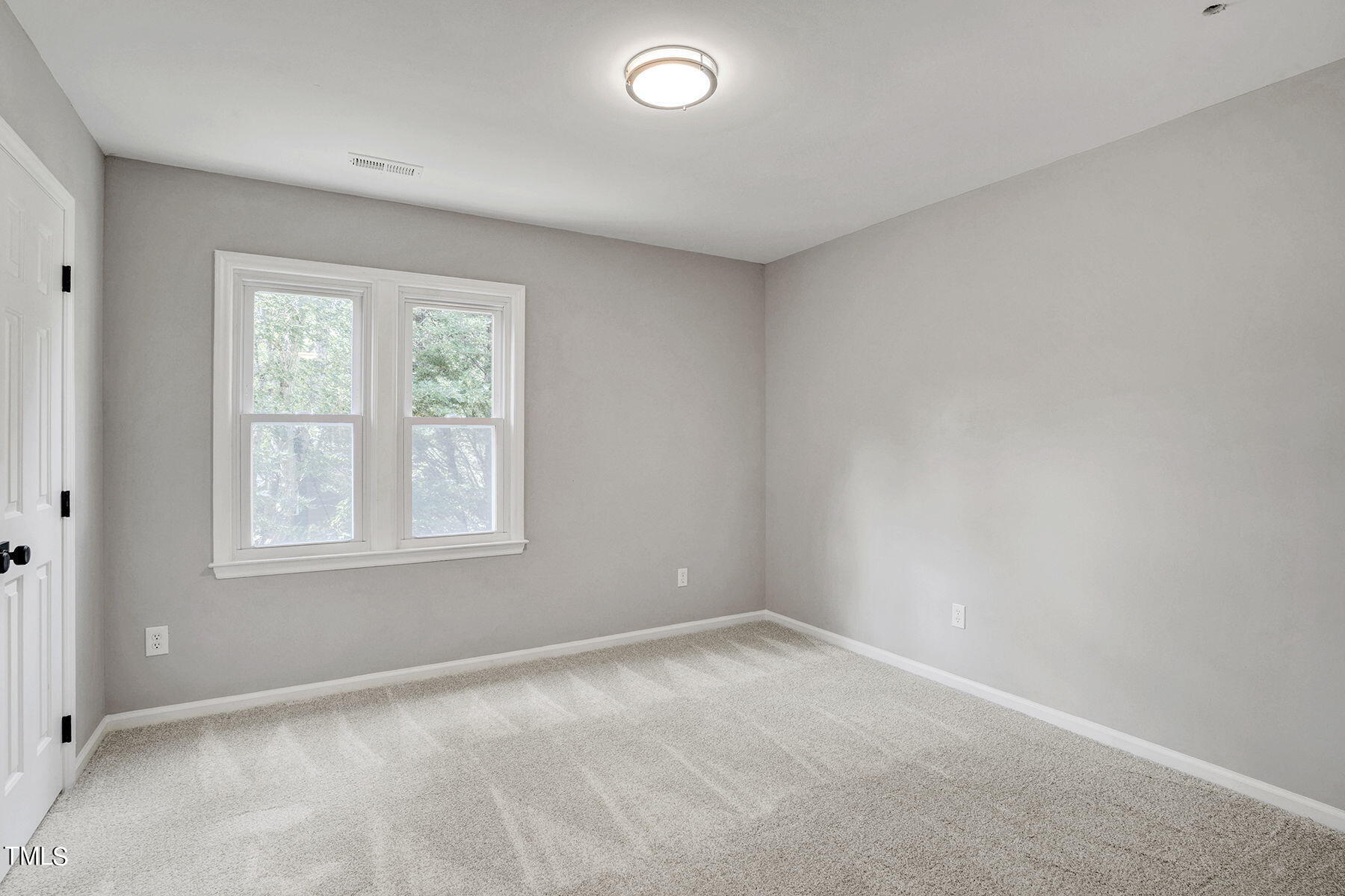 1248 Hillingdon Way Raleigh, NC 27614 - Photo 22 of 32 an empty room with a window