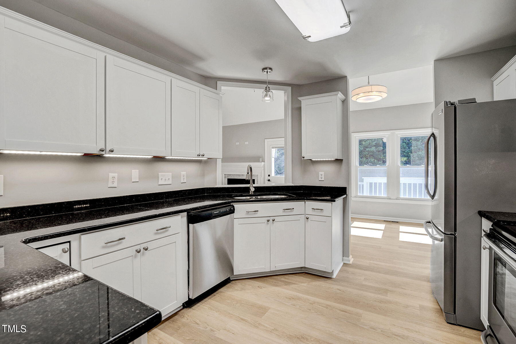 1248 Hillingdon Way Raleigh, NC 27614 - Photo 4 of 32 a kitchen with granite countertop a sink appliances and cabinets