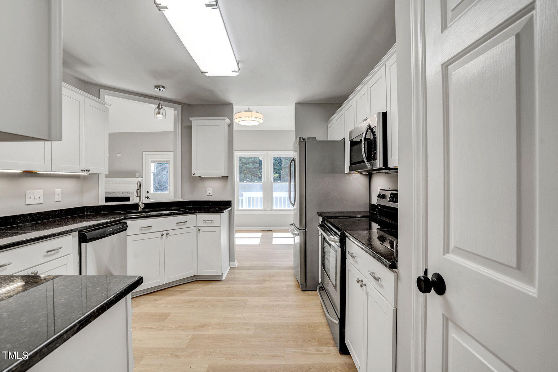 1248 Hillingdon Way Raleigh, NC 27614 - Photo 5 of 32 a kitchen with stainless steel appliances granite countertop a sink stove and refrigerator