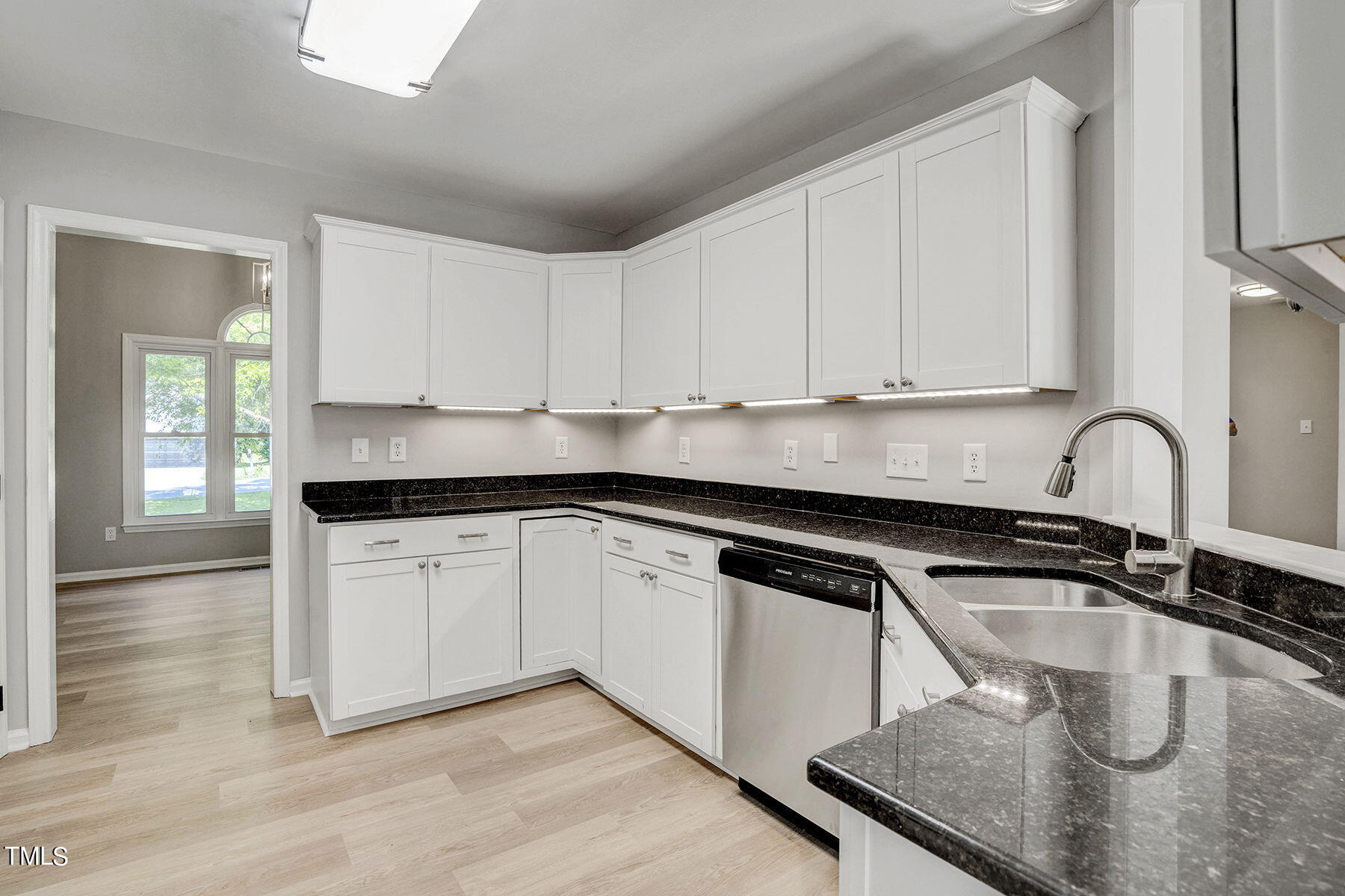 1248 Hillingdon Way Raleigh, NC 27614 - Photo 9 of 32 a kitchen with granite countertop a sink a stove and cabinets