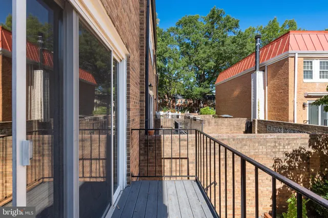 a view of a balcony with wooden floor