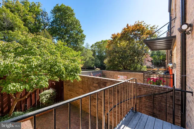 a view of a balcony with wooden floor