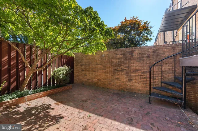 a view of a bench in a backyard