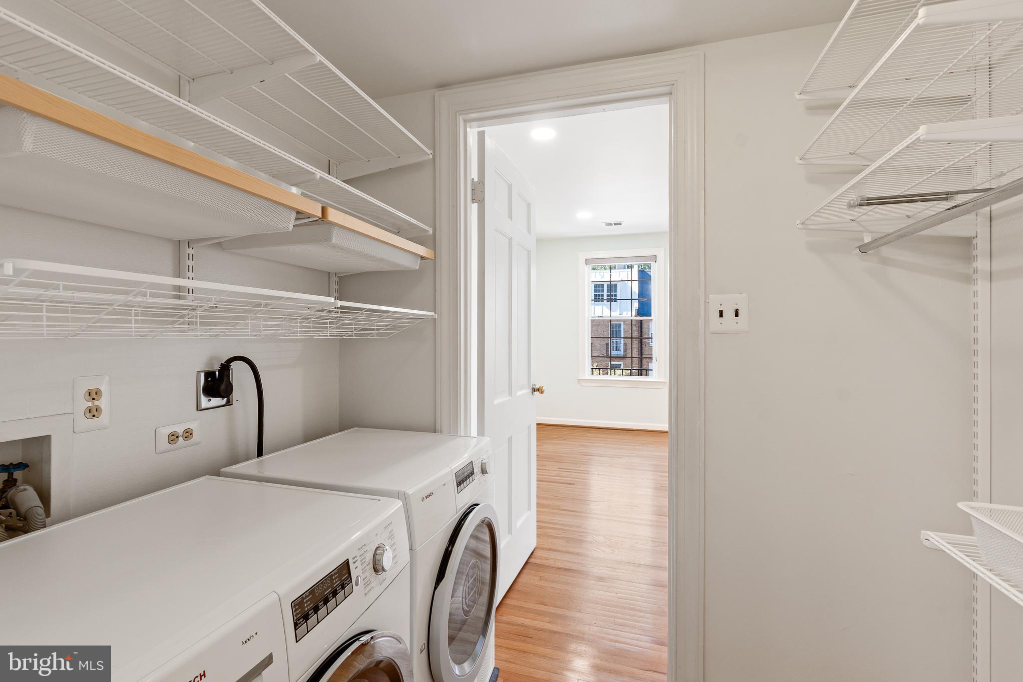 706 6th Street Southwest Washington, DC 20024 - Photo 23 of 39 a bedroom with a bed and a large mirror