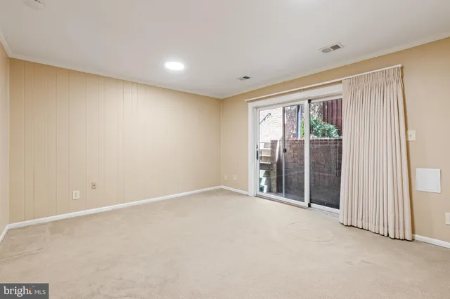 an empty room with sliding door