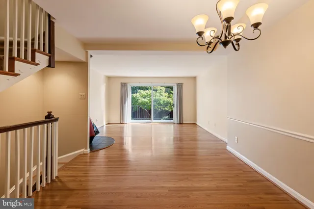 a view of an entryway with wooden floor