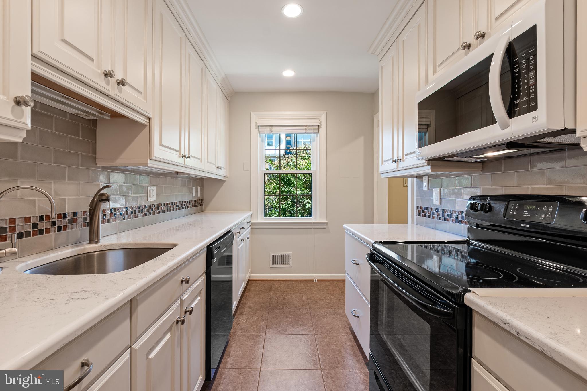 706 6th Street Southwest Washington, DC 20024 - Photo 8 of 39 a kitchen that has a sink and a stove
