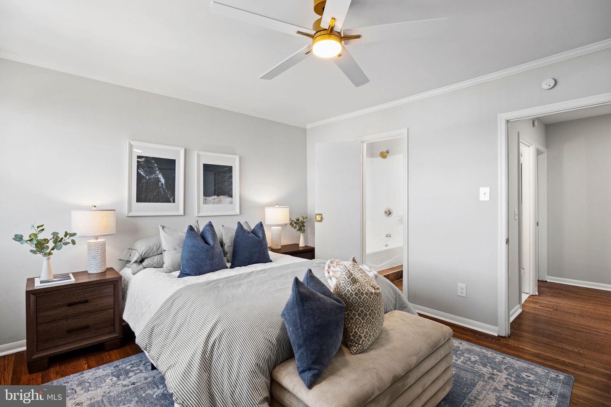 171 North Carol Boulevard Upper Darby, PA 19082 - Photo 14 of 32 a bedroom with a bed and wooden floor