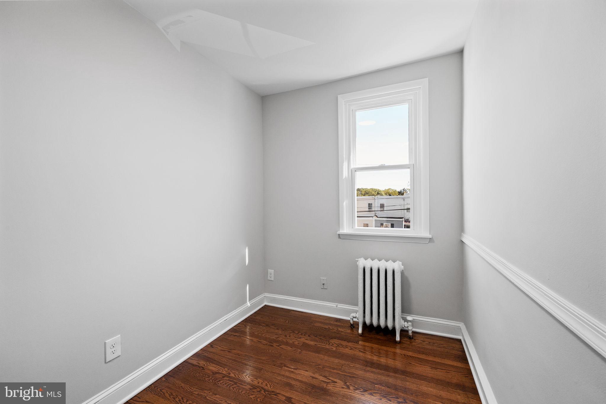 171 North Carol Boulevard Upper Darby, PA 19082 - Photo 19 of 32 a view of empty room with wooden floor and fan