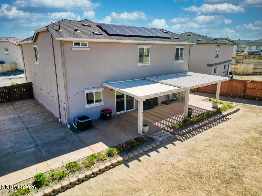 8957 Buffalo Grove Drive Reno, NV 89506 - Photo 50 of 59 a view of a house with backyard and wooden fence