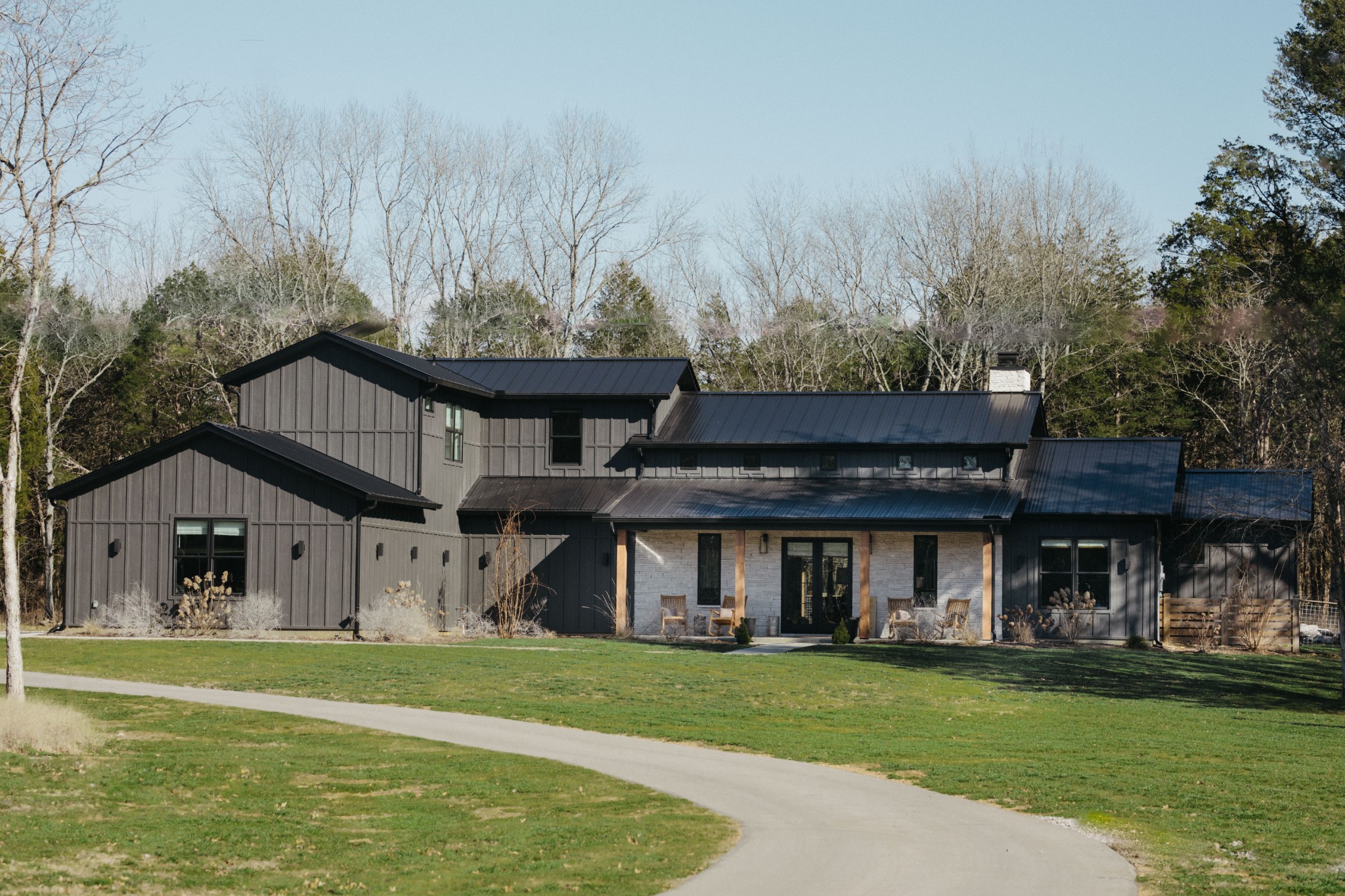 a front view of a house with a garden