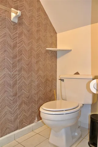 an empty room with a bench