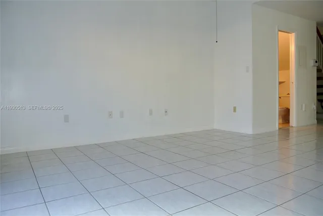 a view of an empty room and window
