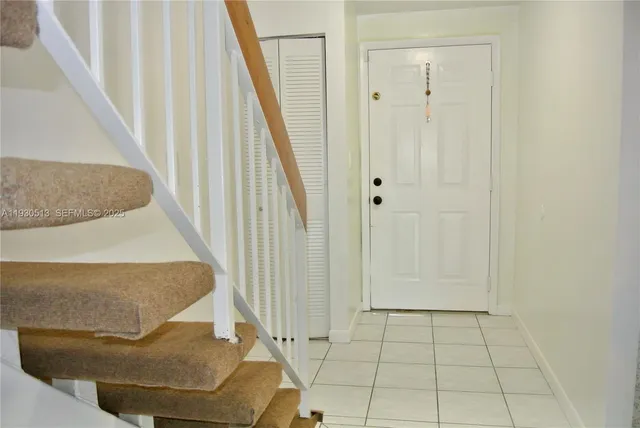 a kitchen with cabinets appliances and a sink