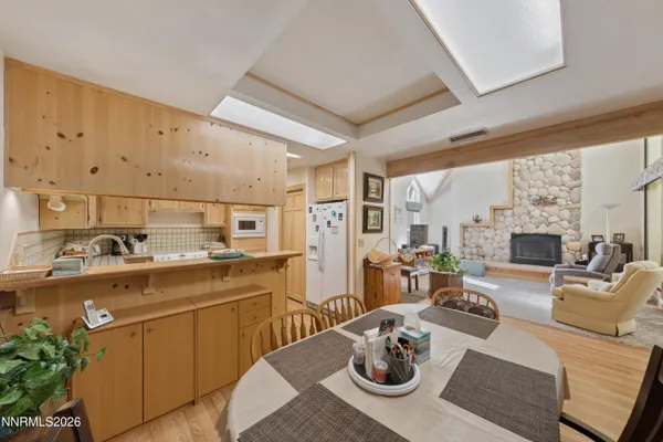 a kitchen with stainless steel appliances granite countertop a sink stove and wooden cabinets