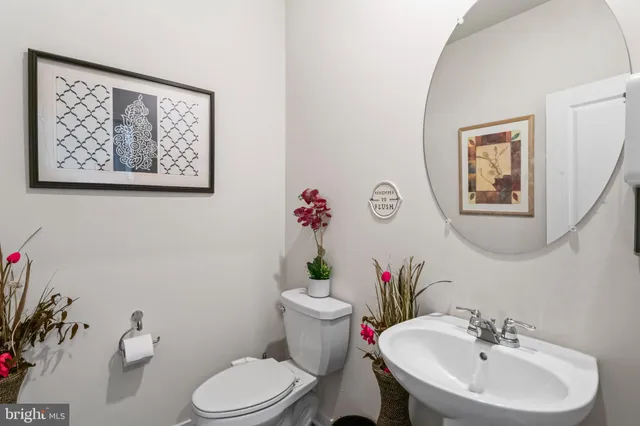 a living room with fireplace furniture and a flat screen tv