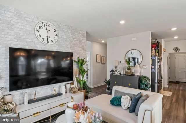 a dining room with furniture and a chandelier