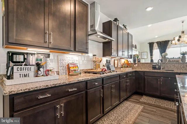 a bathroom with a sink vanity and a mirror
