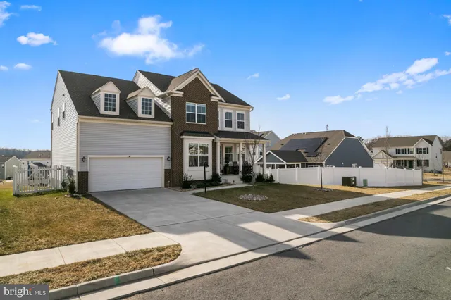 a front view of a house with yard
