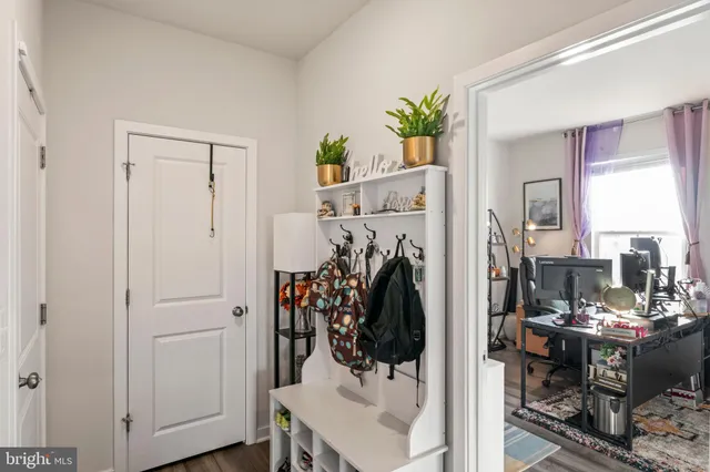 a bedroom with a bed a table and chair