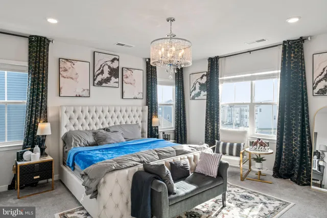 a living room with furniture pool table and a window