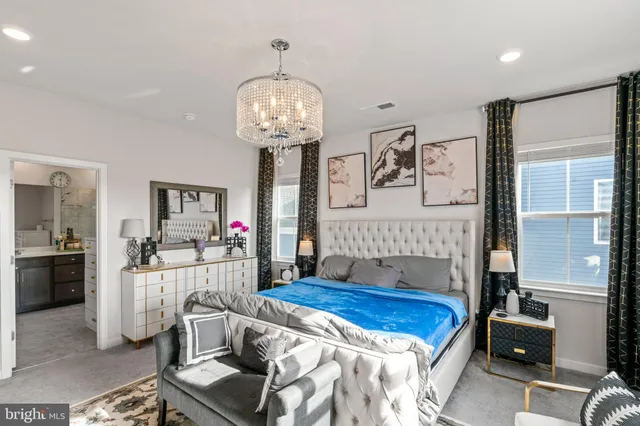 a bedroom with a bed and a desk