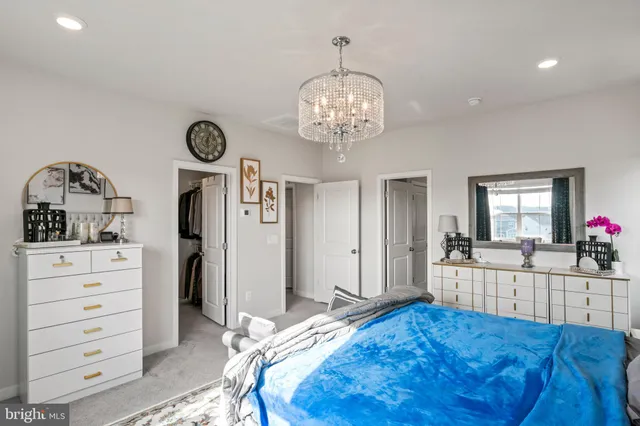 a bathroom with a sink vanity mirror and toilet