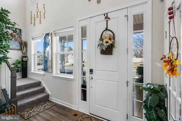 a bathroom with a toilet a sink and a mirror