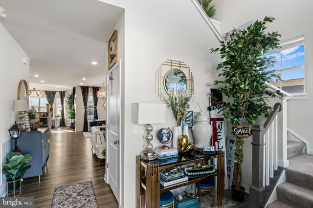 a living room with lots of furniture and kitchen view