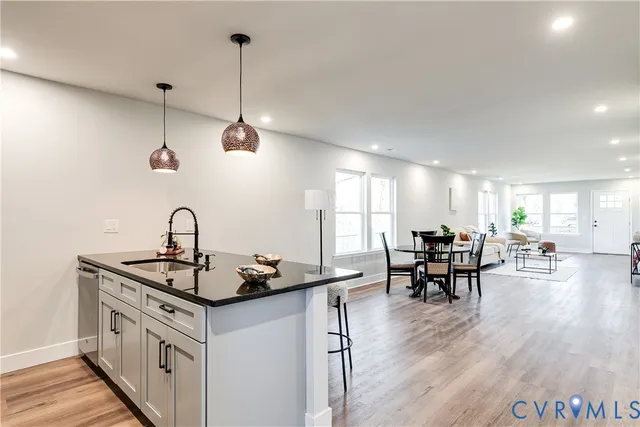 a kitchen that has a table and chairs in it