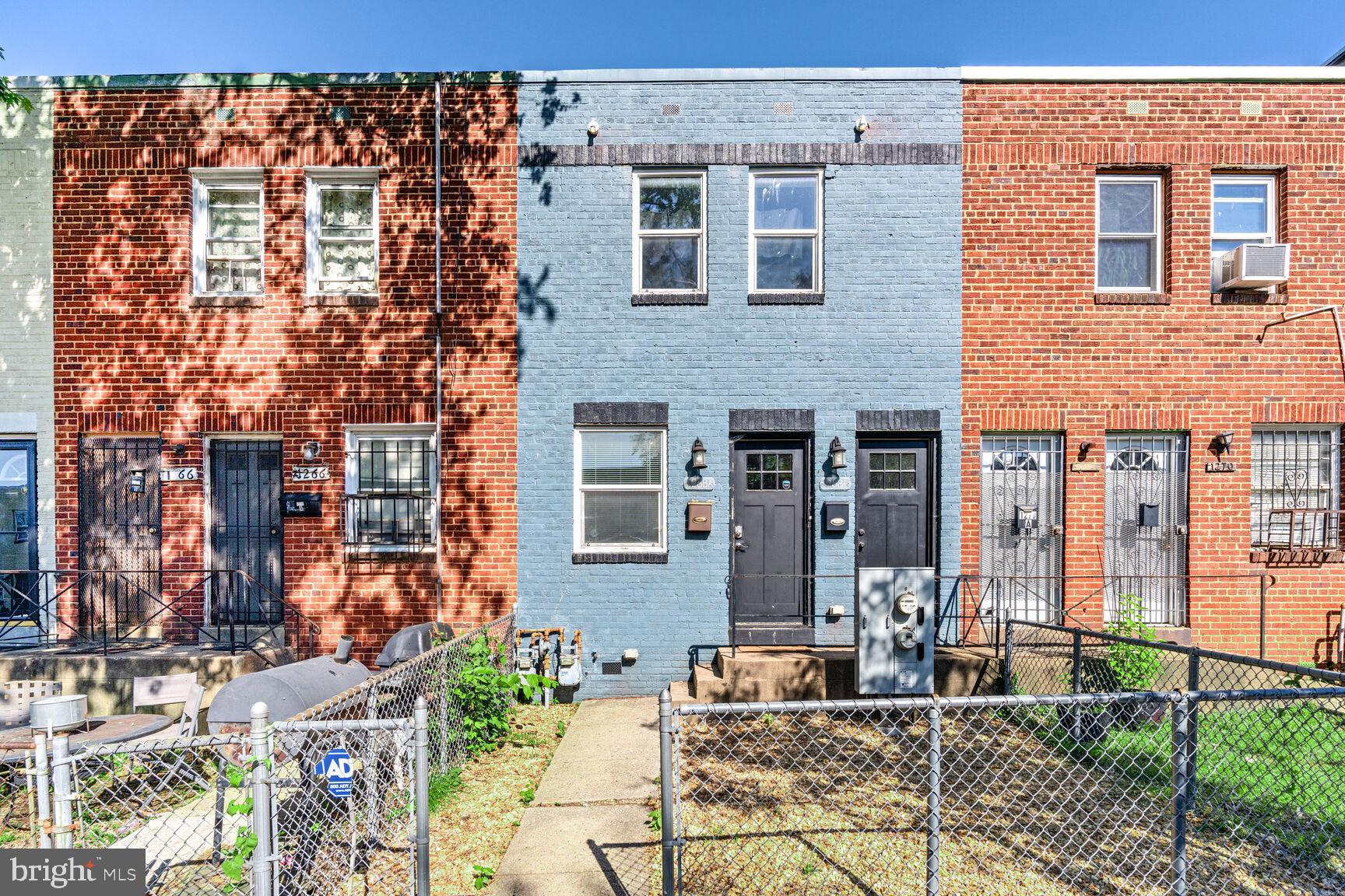 1268 16th Street Northeast Washington, DC 20002 - Photo 1 of 17 a front view of a house with a garden