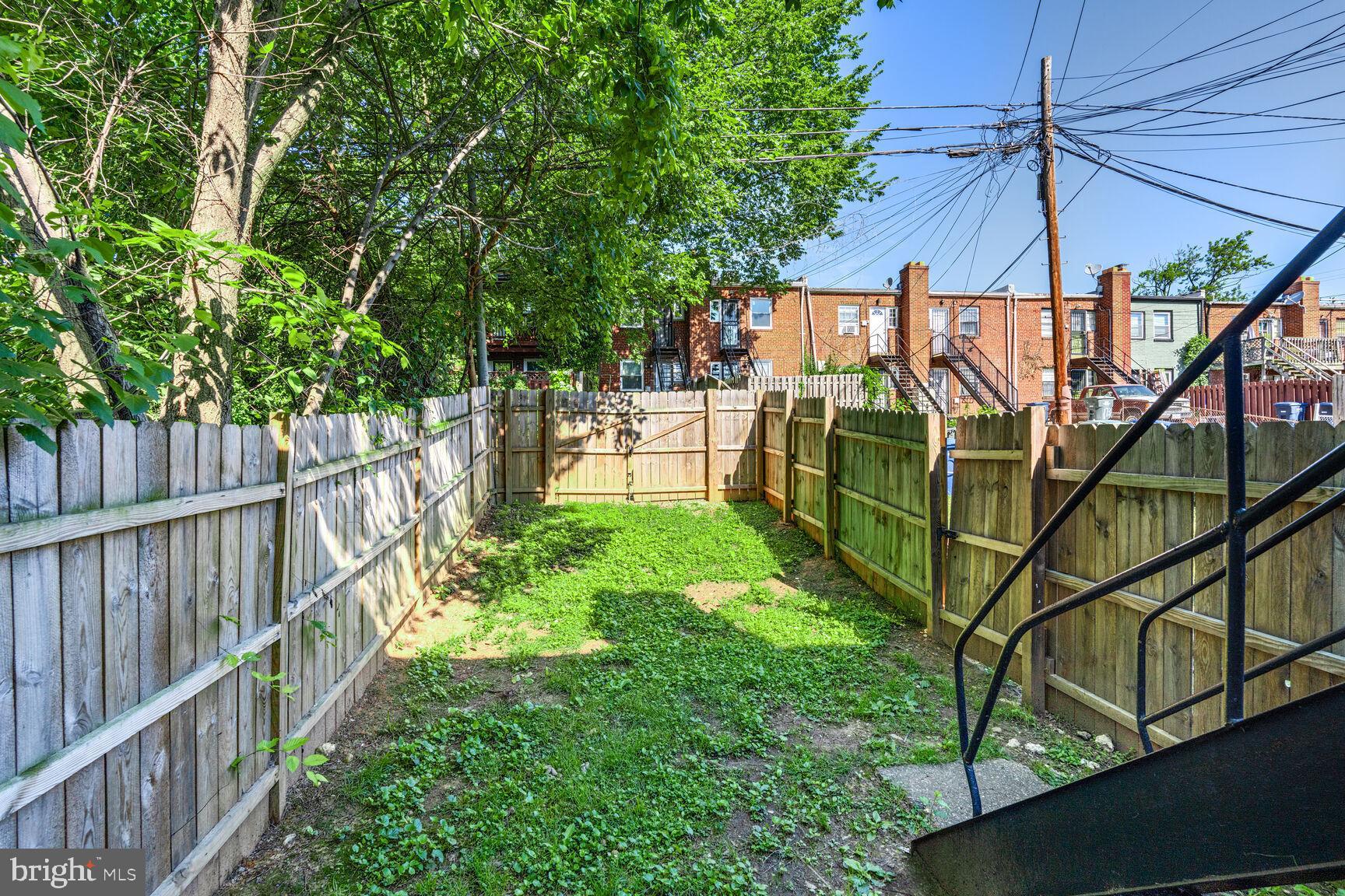 1268 16th Street Northeast Washington, DC 20002 - Photo 16 of 17 a view of yard from deck having patio