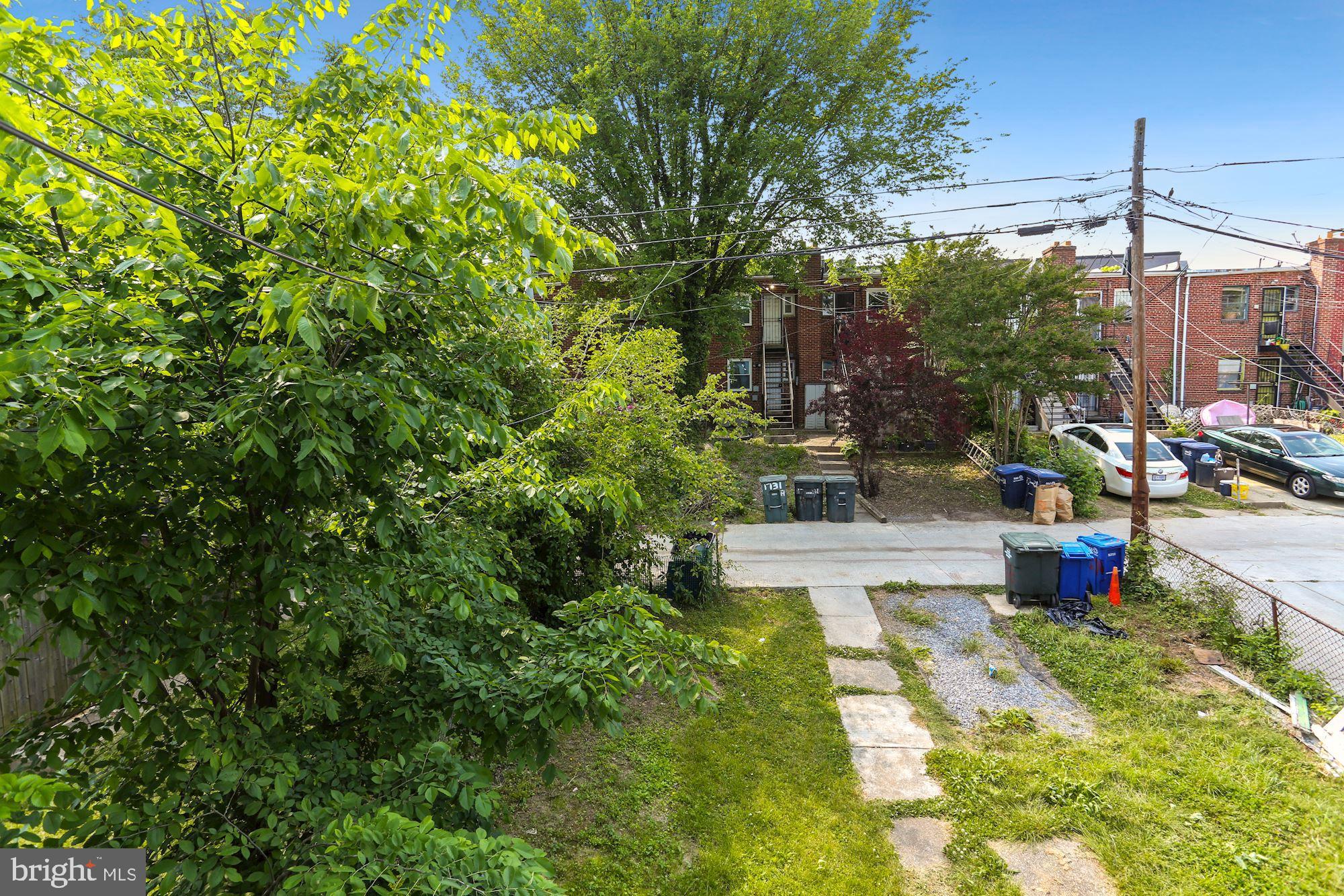 1268 16th Street Northeast Washington, DC 20002 - Photo 17 of 17 a view of yard with fountain and large trees