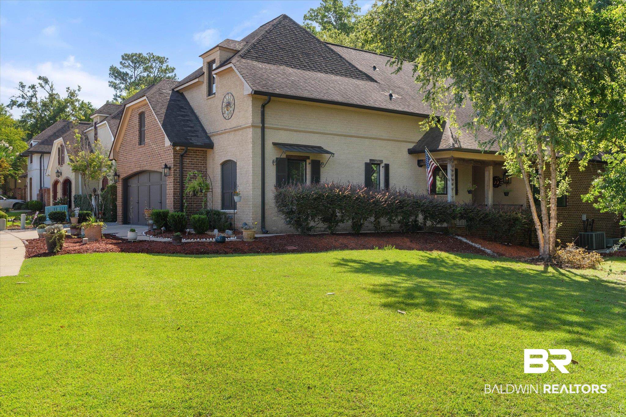 3400 Rue Royal Mobile, AL 36693 - Photo 29 of 33 View of front of house with brick siding, a shingled roof, and a front lawn