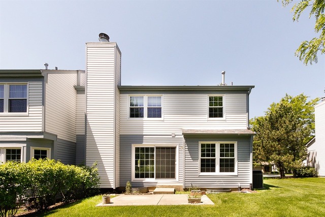 1712 Napoleon Drive Naperville, IL 60565 - Photo 19 of 19 a front view of a house with a yard