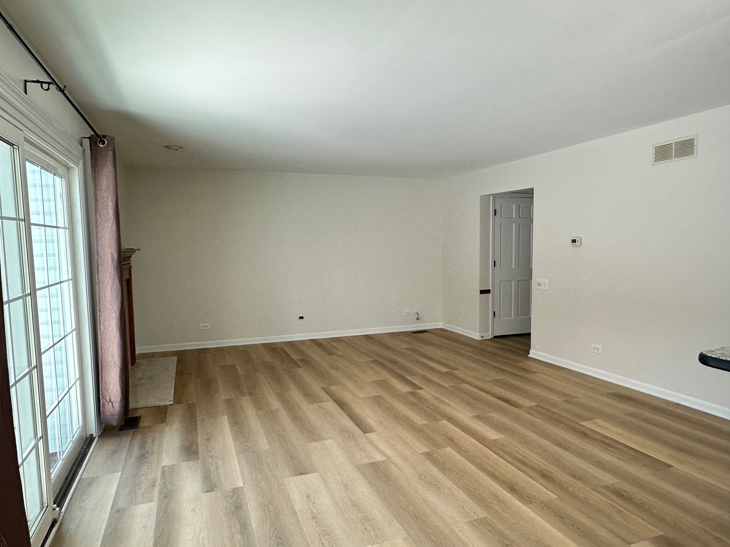 1712 Napoleon Drive Naperville, IL 60565 - Photo 5 of 19 a view of room with window and wooden floor