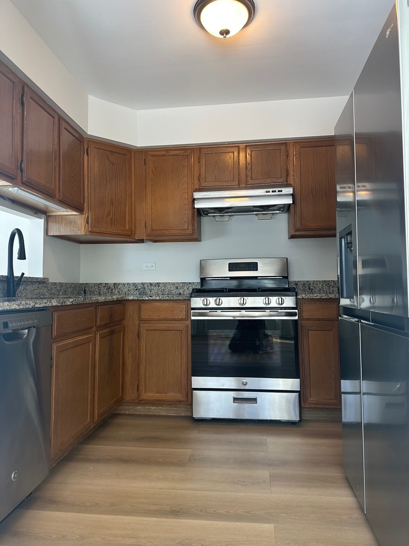1712 Napoleon Drive Naperville, IL 60565 - Photo 7 of 19 a kitchen with a stove and a sink
