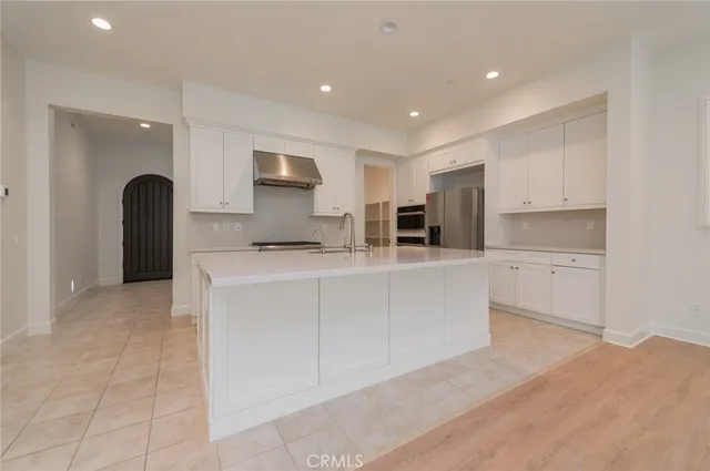 a kitchen with counter top space cabinets and stainless steel appliances