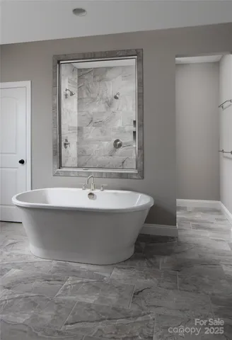 a bathroom with a bathtub and shower